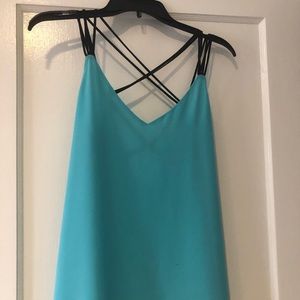 Blue top with criss cross in the back